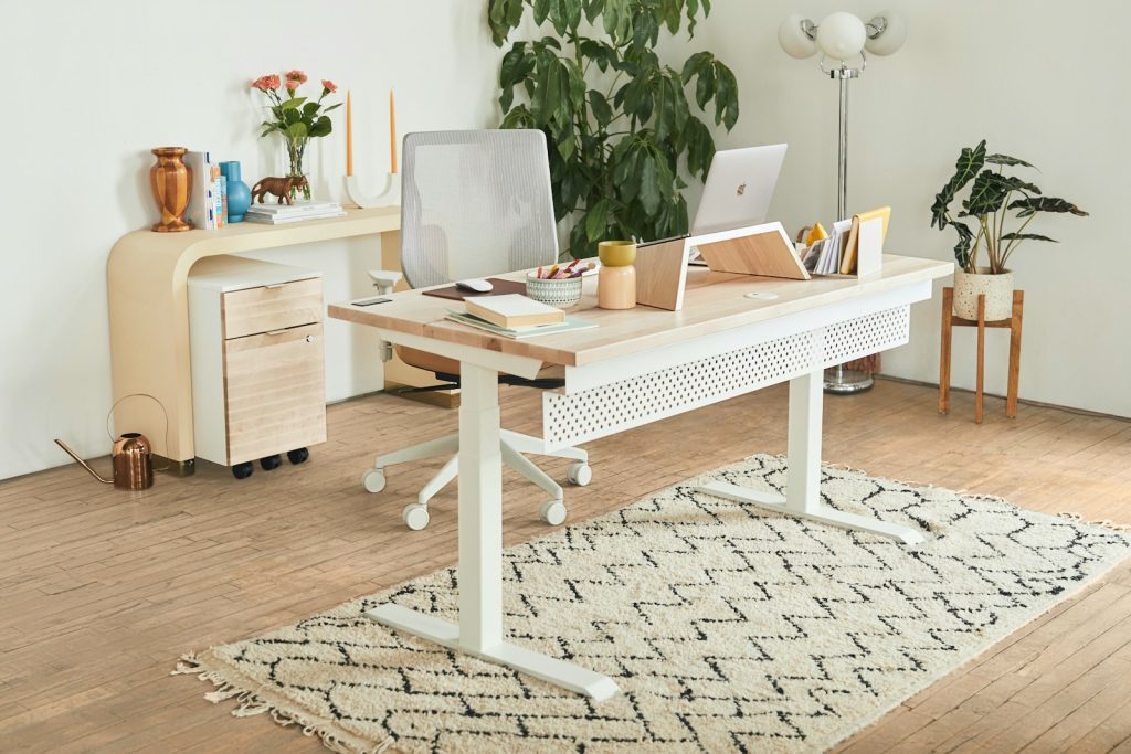 a white minimalist office with desk and console